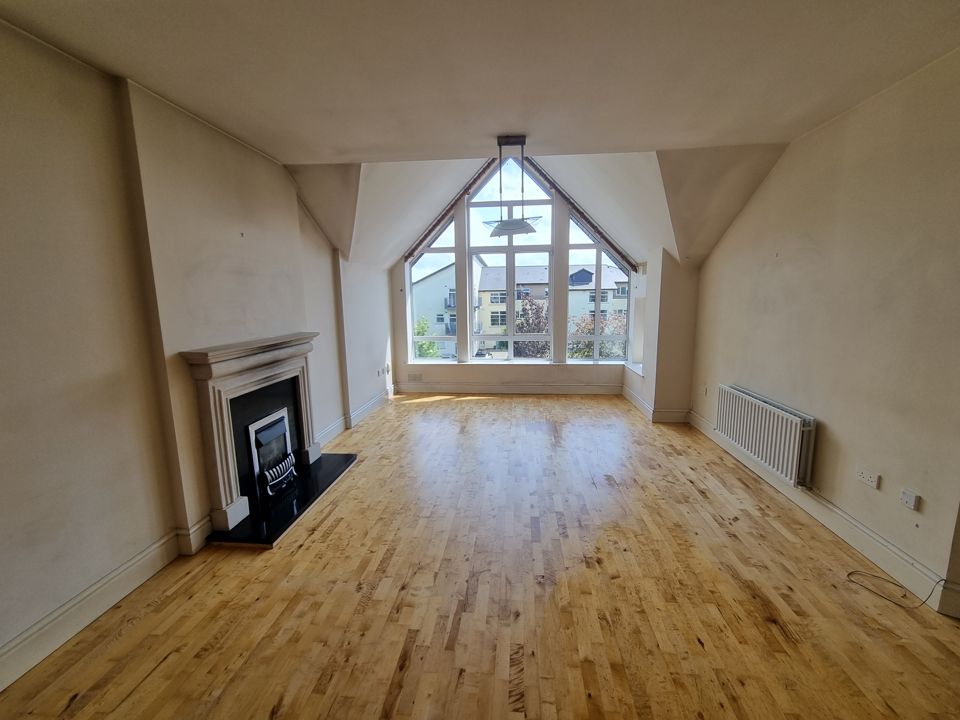 The same apartment living room empty and swept after clearance