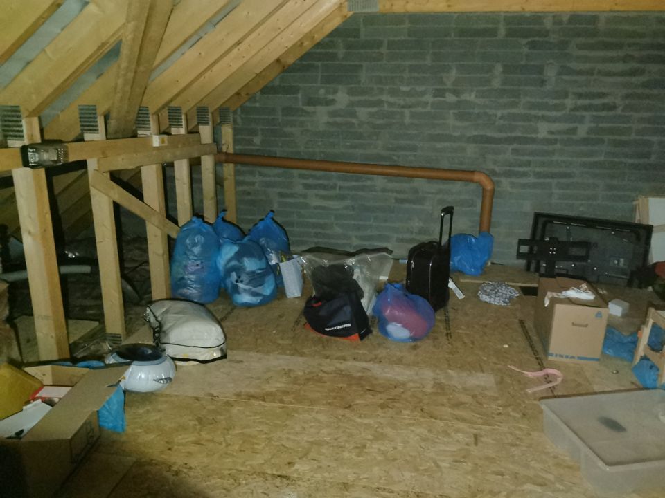 Attic full of bags and boxes before clearance